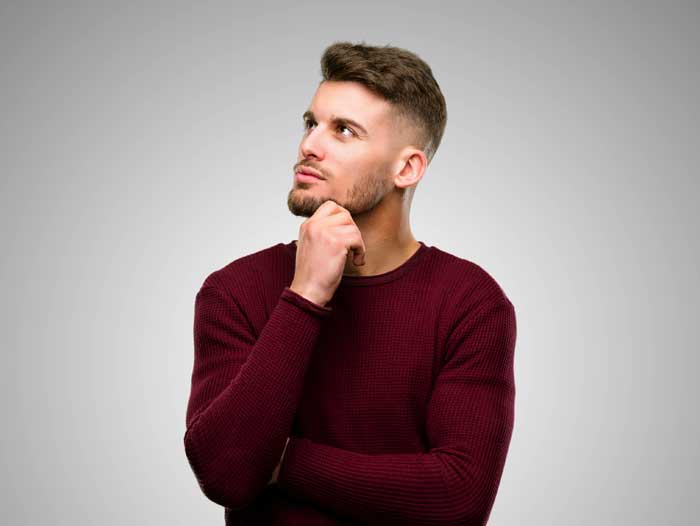 man thinking about bridging loan